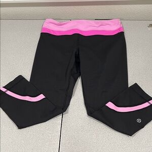 lululemon athletica Black Leggings with Pink Trim Zipper in back size 6